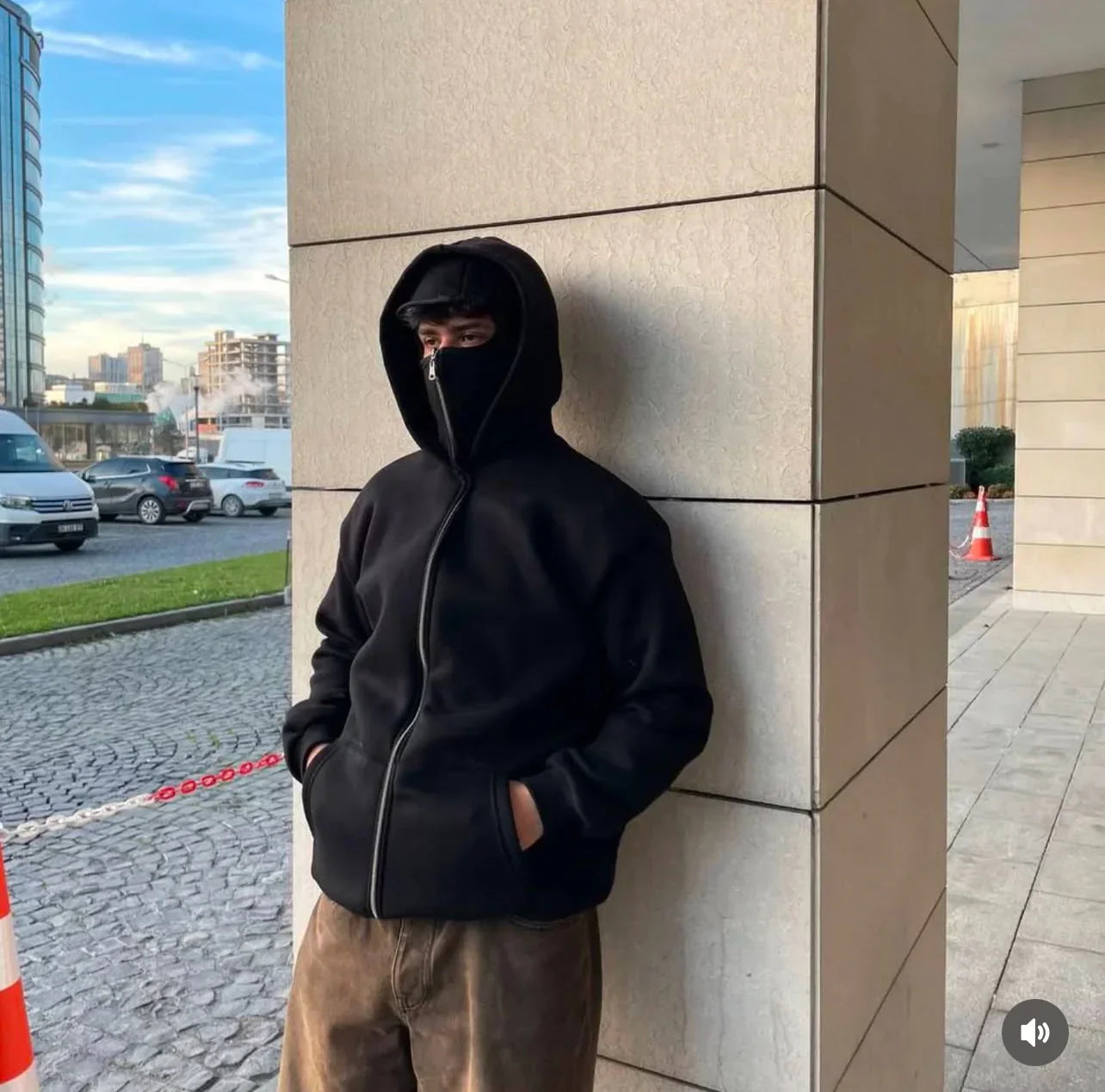 Man wearing black Balaclava Ninja Hoodie for smog protection in Pakistan.